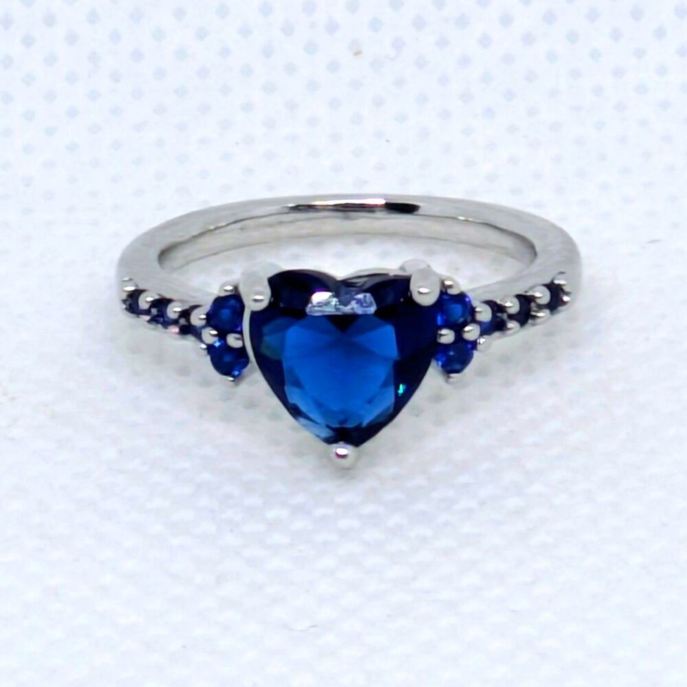 Women's BRAND NEW sparkling Blue CZ Heart Ring in a Size 5. Silver Tone Jewelry